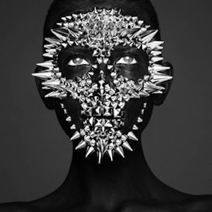 Death Spikes, Mask II by Eankin, portrait of a model painted black, silver spikes forming a skull mask over her face