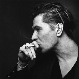 Gary Oldmann by Nigel Parry, black and white portrait of the actor in side profile smoking