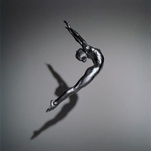 Artemis by Guido Argentini, nude model painted silver, jumping