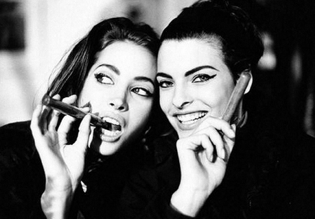 Elgort_Christy Turlington and Linda Evangelista by Arthur Elgort, the two Models smiling and pretending to smole cigars