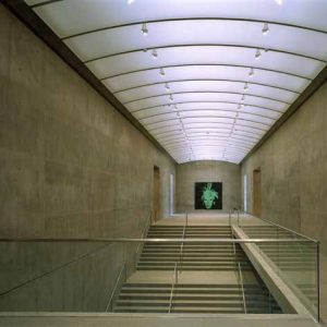 INTERIOR, THE MODERN ART, MUSEUM OF FORT WORTH, FORT WORTH, TEXAS, by Robert Polidori, minimal concrete interior with staircase and glass railings, a green picture of warhol on the wall