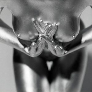 Kali by Guido Argentini, closeup of nude models silver painted chest and hands