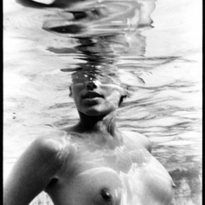 Emma underwater 1990 by Arthur Elgort, models nude torso underwater