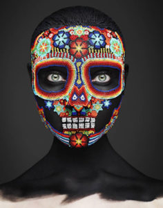 Epitaph II by Rankin, portrait of Model with colorful skull mask made of small beads