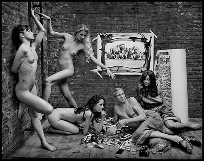 peter beard by mark Seliger, the photographer lounging on the floor surrounded by nude women and prints