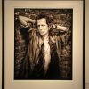 Keith Richards in my Stairwell by Mark Seliger, the3 musician leaning on a brick wall, framed black