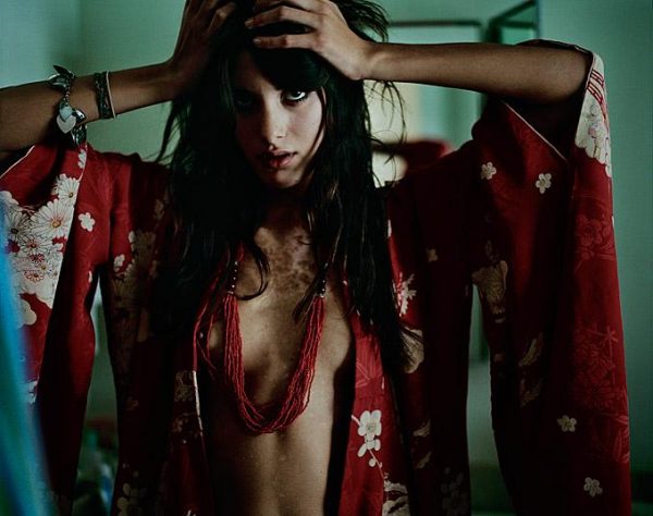 BIRTHMARK – SONJA KINSKI by Marc Baptiste, model in red kimono and necklace, hands in her hair