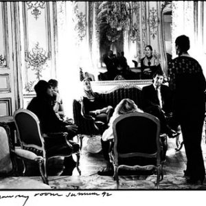 Karl Lagerfeld's Salon. 1991 by Arthur Elgort, a group of people sitting on sofas in a baroque interior