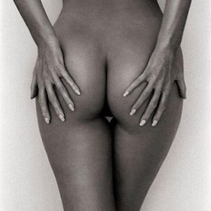 Philippa, Santorini 1995 by Andreas H. Bitesnich, closeup of nude grabbing her butt