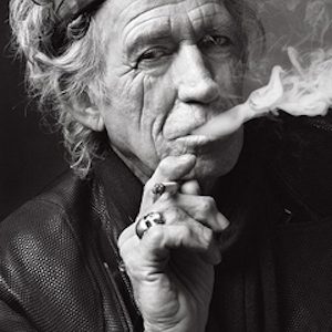 keith richards smoking by Mark Seliger, black and white portrait of the musician in a bandana