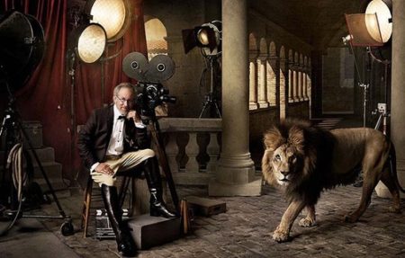 Steven Spielberg and Lion by Mark Seliger, the director in an antique architecture between film equipment, next to a lion