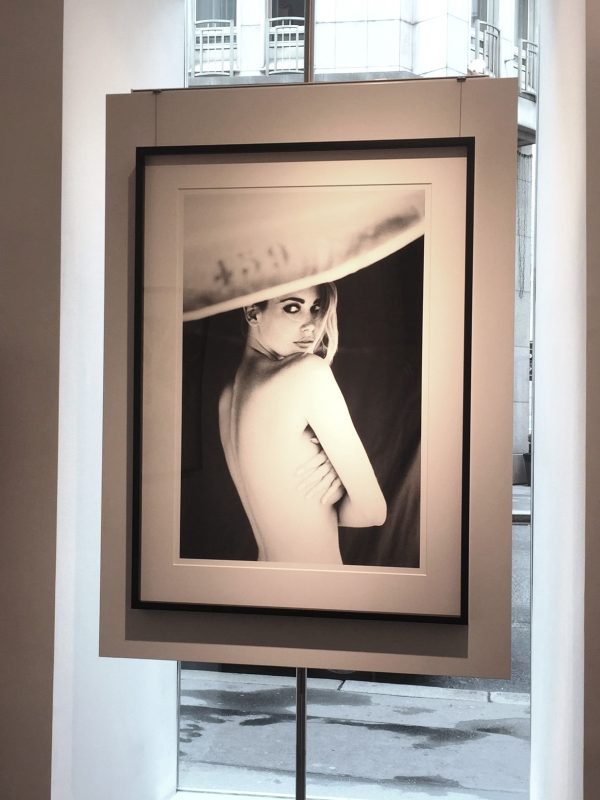 Claudia Schiffer, Parasol by Ellen von Unwerth, portrait of the nude model looking back over her shoulder