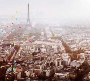 Balloons over Paris by David Drebin, colorful balloons floating over the city with the eifeltower in the back