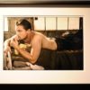 Leonardo DiCaprio, Los Angeles. 2008 by Mark Seliger, the actor lying on a military bed in jeans, shirtless, framed black