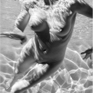 Carre Otis Underwater. 2001 by Antoine Verglas, nude model swimming in a pool, underwater