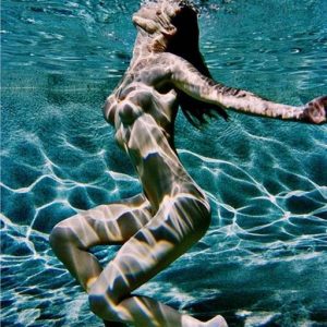 Carre Otis Underwater Color. 2001 by Antoine Verglas, nude model underwater in a pool with sun reflections