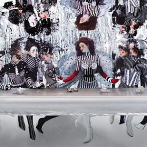 The Last Supper Underwater, 2005 by Howard Schatz, recreation of DaVincis last supper with models in black and white clown costumes, underwater