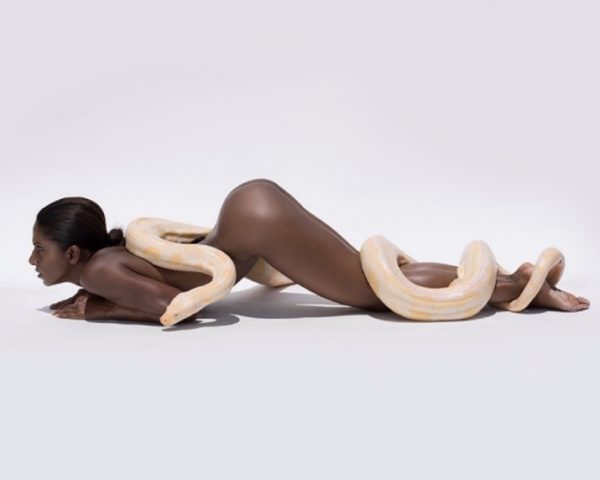 Nirmala and the Giant Albino Python II. 2017 by Sylvie Blum, nude model lying on her belly with a white and yellow snake draped over her body