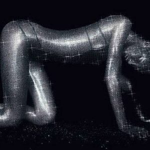 Sparkly Gisele. 1998 by Rankin, the model on all fours, covered in silver glitter