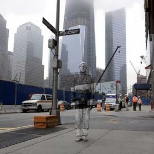 Ground Zero by Liu Bolin, person painted to match the background at cedar street, world trade center memorial site