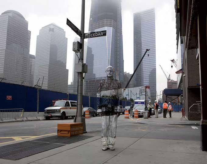 Ground Zero by Liu Bolin, person painted to match the background at cedar street, world trade center memorial site