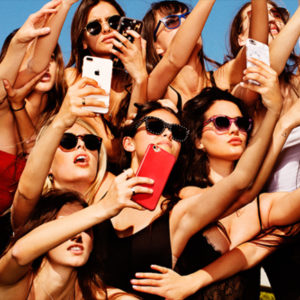 Model Nation by Tony Kelly, a group of models in sunglasses, each taking a selfie