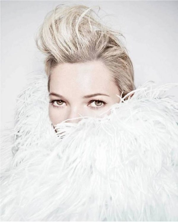 Furry Kate with Quff, 2011 by Rankin, portrait of the model in white feather boa
