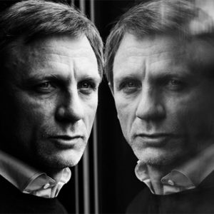 Daniel Craig by Nigel parry, portrait of the actor with his mirror immage in a window