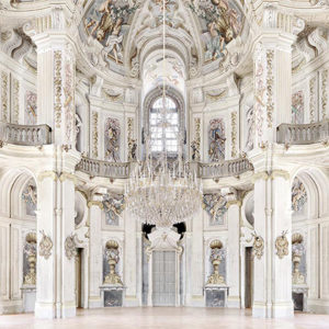 castle stupinigi by Massimo Listri , baroque interior with white stucco and pastel fresco, big chandelier and gallery