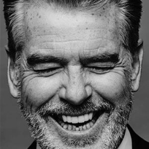Pierce Brosnan by Nigel Parry, close up portrait of the actor laughing