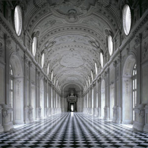 Reggia di Venaria by Massimo Listri, long hall in white baoque stucco decor and checkerboard floor