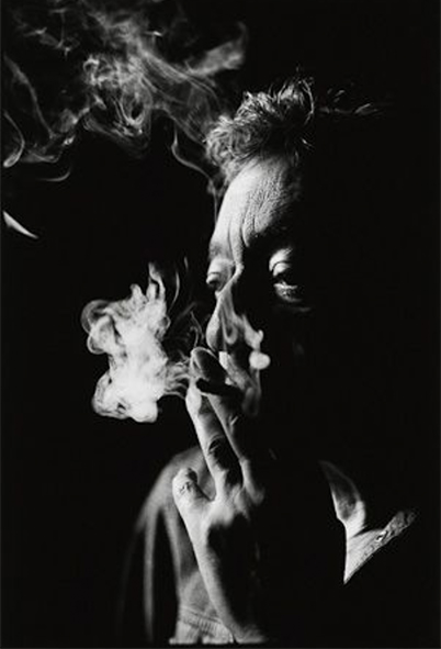 Serge Gainsbourg by Nigel Parry, black and white high contrast portrait of the actor smoking