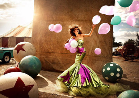 Circus II by Kristian Schuller, model in gren and pink mermaid dress with pink and green balloons