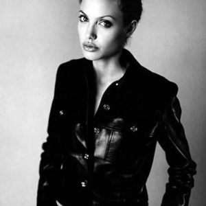 angelina jolie by Sante D'Orazio, black and white portrait of the actress in a black leather jacket
