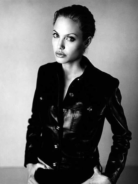 angelina jolie by Sante D'Orazio, böack and white portrait of the actress in a black leather jacket
