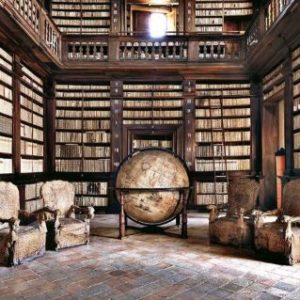 Biblioteca Fermo by Massimo Listri, library with wooden shelves and gallery and giant globe