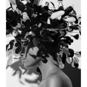 Charmaine Paris 1991 by Bruno Bisang, model in side profile wearing a big feather headpiece