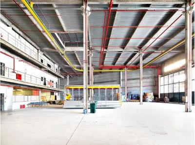 Cidade do Samba II by Massimo Listri, industrial hall with red and yellow iron bars