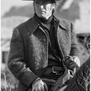 Clint Eastwood by Terry O'Neill, portrait of the actor in wooljacket and hat, riding a horse