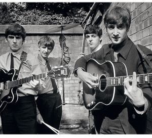 The Beatles backyard by Terry O'Neill, the band with their instruments