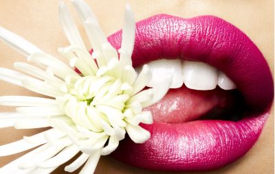 Chrysanthemum Bitten by Rankin, model with pink lips biting into a white flower
