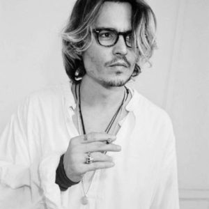 Johnny Depp, Venice by Roxanne Lowit, black and white portrait of the actor in shite shirt smoking