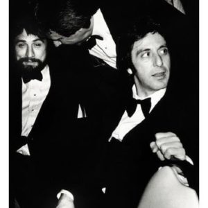 Robert De Niro and Al Pacino, NY 1982 by Roxanne Lowit, the actor sitting next to each other in suits