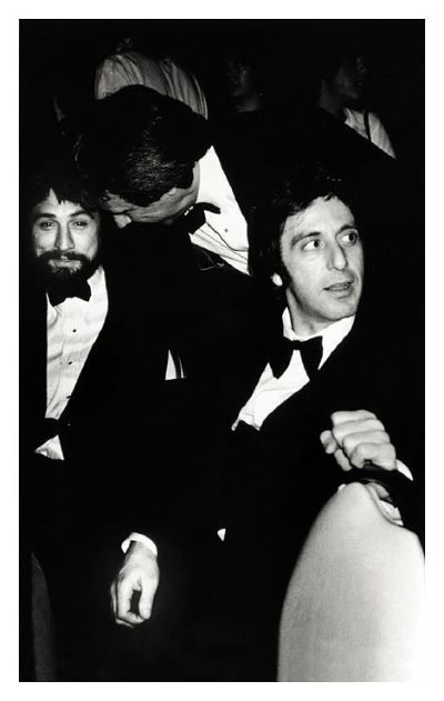 Robert De Niro and Al Pacino, NY 1982 by Roxanne Lowit, the actor sitting next to each other in suits