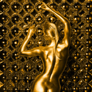 ERIS GOLD by Guido Argentini, gold painted model in front of a wall full of mirror balls