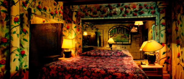 Bedroom at the Oasis Hotel - Las Vegas 2000 by Albert Watson, heavily decorated bedroom with flowers in walls and bedsheet
