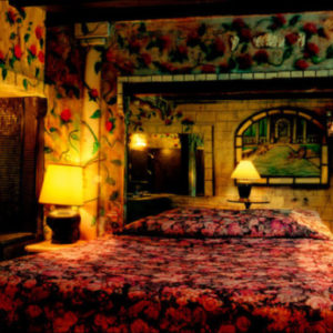 Bedroom at the Oasis Hotel - Las Vegas 2000 by Albert Watson, heavily decorated bedroom with flowers in walls and bedsheet