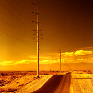 Electrical Pylons - Road Yet to be named- Las Vegas 2001 by Albert Watson, a road through the desert in orange