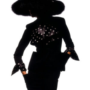 Gabrielle Reece - France 1989 by Albert Watson, model in black powersuti with polkadot details and big fur hat