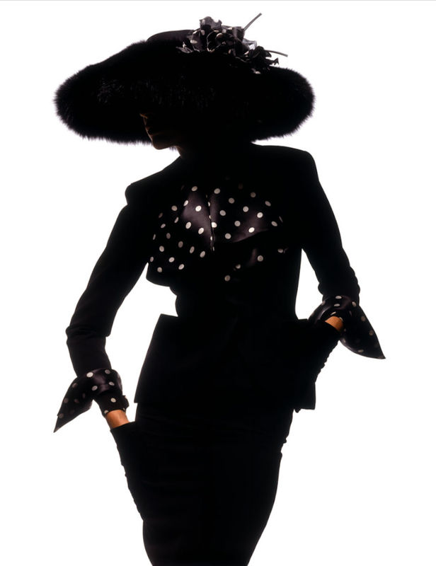 Gabrielle Reece - France 1989 by Albert Watson, model in black powersuti with polkadot details and big fur hat